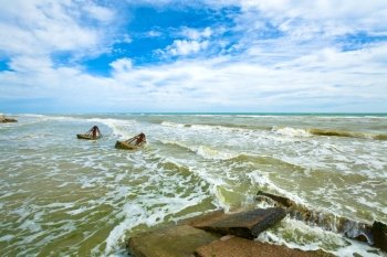 breakwaters and sea surf wave break on coastline (Crimea, Ukraine)