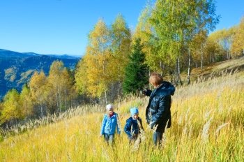 Family (mother with children) walk on autumn  mountain Nimchich pass (Carpathian, Ukraine) .