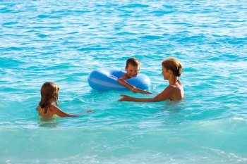 Family (mother with two children) have the water-based recreation on Ionian sea, (Lefkada, Greece)