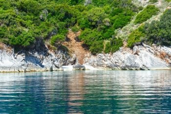 Small beach and summer coast view from motorboat (Kefalonia, not far from Agia Effimia, Greece)