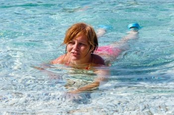 Woman bathing in the sea. Summer vacation (Greece, Kefalonia, Beach Antisamos).