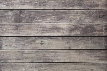 background consisting of part of weathered grey boards