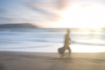Motion blurred photo of man with guitar, UK.