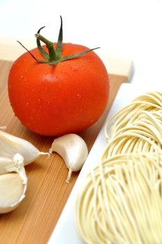 Fresh tomato, noodle and garlic; prepare for your dinner  