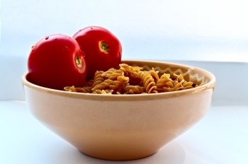 Plate of wholemeal pasta with tomatoes