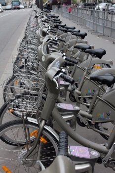 Velib bucycles in the row on in Paris, France. Velib is a large-scale public bicycle sharing system in Paris, France.