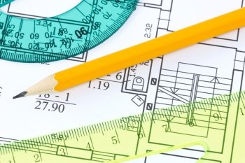 scale rulers and pencil on architectural drawing blueprint 
