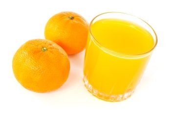 two mandarines and juice glass  on white background