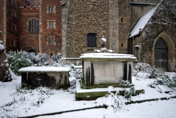 Snow-covered tombs in the grounds of Lambeth Palace, London, England.
