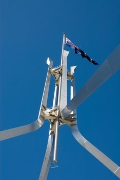 The Australian flag, atop a large flag pole, Parliament House, Canberra, Australia