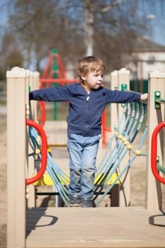 Young boy in the playground on a sunny day