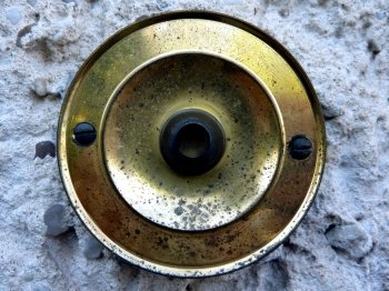 Bell. golden and black bell  button