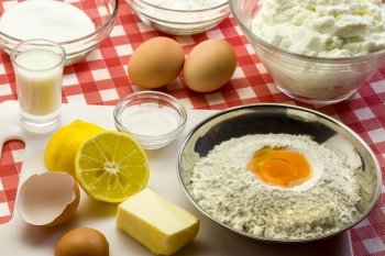 Ingredients for a cake - flour, butter, eggs, baking powder, sugar