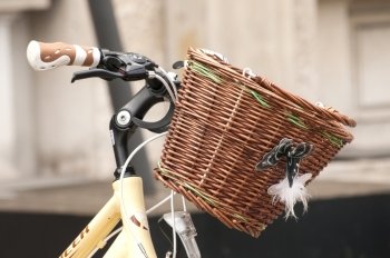 Pretty retro front wicker bicycle basket closeup 