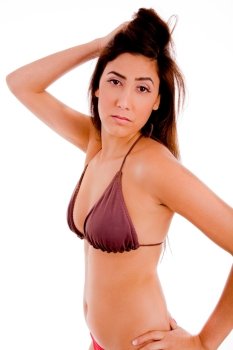 side view of sexy female in bikini looking at camera on an isolated white background