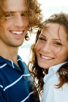 Smiling man and woman in front of camera