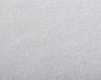 Grey fabric texture. Clothes background. Close up. Fabric background