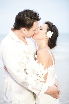Bride and groom romantic kiss