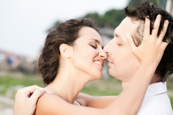 Portrait of kissing attractive couple