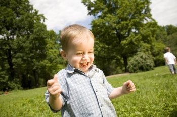 Happy Smilling Little Boy In The Park