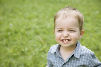 A Smiling Little Kid Outdoors