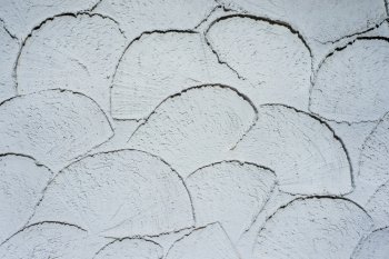 White wall of concrete with structured plaster