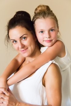 Photo of mother and daughter in white