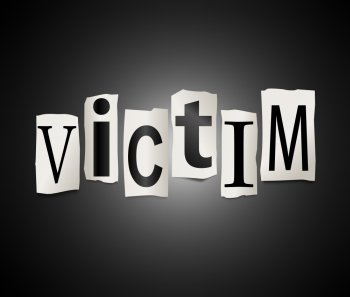 Illustration depicting a set of cut out printed letters arranged to form the word victim.