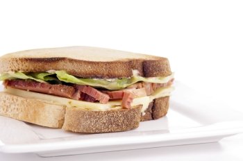 Gluten free sandwich with home-made bread, cheese, roast beef and lettuce