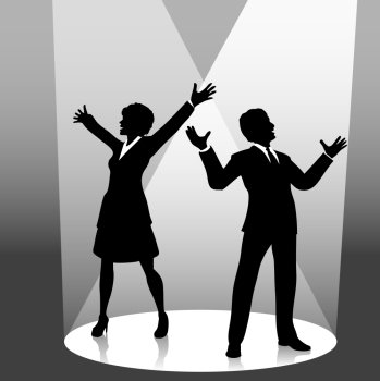 A business man symbol raises his fist in celebration of success on stage in a spotlight.