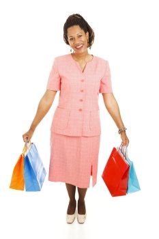 Happy african-american woman with her shopping bags.  Full body isolated on white  
