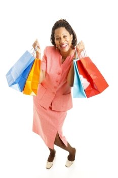 Excited african-american woman, holding shopping bags.  Full body isolated on white.  