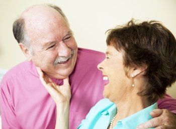 Beautiful senior couple in love, sharing a laugh together.  