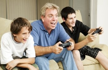 Uncle plays video games with his nephews.  Could also be father.  