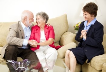Happy senior couple benefits from marriage counseling.  
