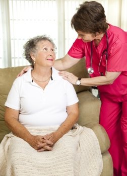 Nurse helps senior woman.  Could either be in-home care or at a nursing home or assisted living facility.  