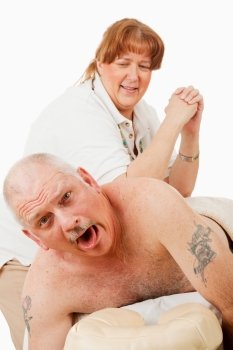 Humorous photo of a man surprised by a painful massage from an overly enthusiastic masseuse.  