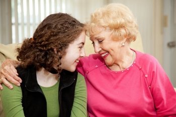 Loving teen girl and her grandmother make eye contact.  
