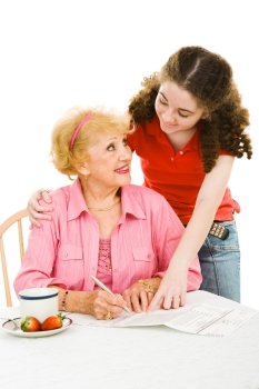 Teen girl helping senior woman fill out absentee ballot.  Isolated on white.  