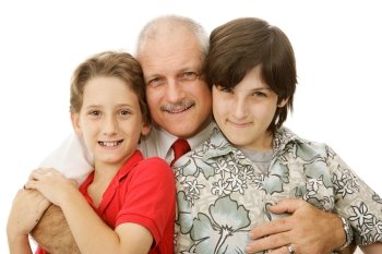 Handsome mature man hugging his two adorable sons.  Isolated on white.  