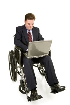 Disabled businessman in wheelchair working on his laptop.  Full body isolated on white.