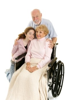 Disabled senior lady with her loving husband and granddaughter.  