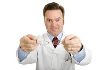 Optician holding out a new pair of reading glasses toward you. Isolated on white.  