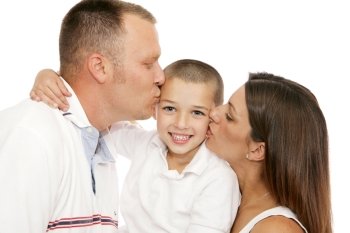 Adorable little boy getting kisses from his mother and father.  Isolated on white.  