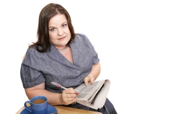 Plus-sized businesswoman reads classifieds, discouraged by poor job market.  Isolated on white.  