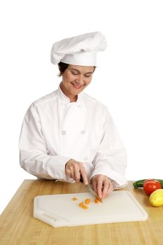 A chef slicing vegetables in preparation for cooking.  Isolated on white.  