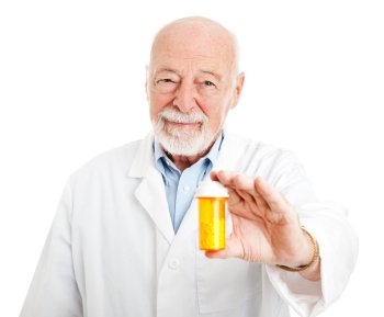 Friendly pharmacist holding a bottle of pills.  Isolated on white.  