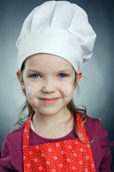 An image of a little girl in white hat