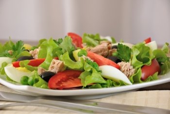 Vegetable salad with tuna, egg and olives