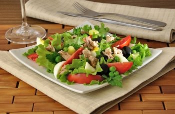 Vegetable salad with tuna, egg and olives